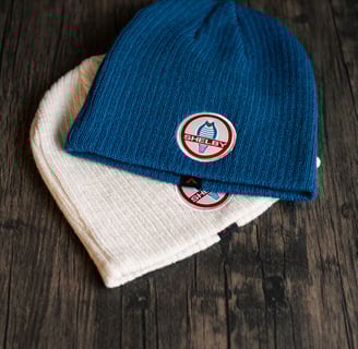 a pair of beanies with a blue and white hat, Product photography, Amazon Photoshoot, Ecommerce 