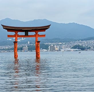 Miyajima Tori Gate and Hiroshima city in the background
