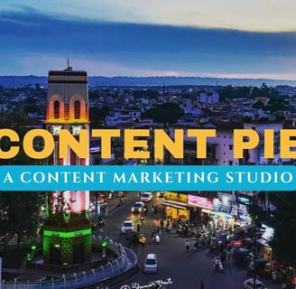 Dehradun cityscape with clock tower in the foreground with text Content Pie Studio