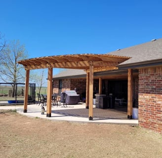 a patio with a cedar pergola