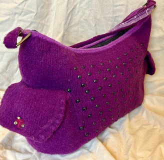 Purple felted purse with black beads and two side pockets 