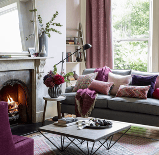 a living room with a couch and a fireplace
