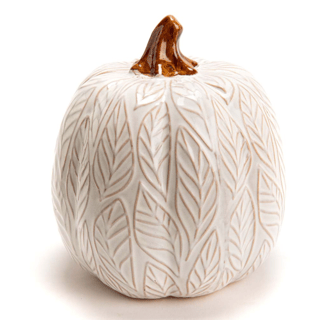 a white ceramic pumpkin with a leafy pattern