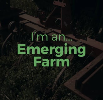 a tractor with a green sign that says i'm an emerging farmer