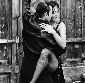 a man and woman dancing in a dance pose