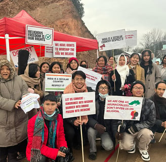 a group of people holding signs and holding signs