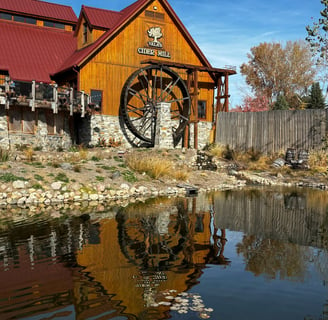 photograph of wooden house with wheel from travels to nebraska