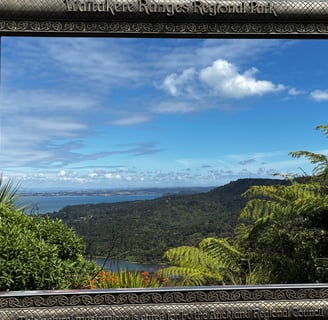 the beautiful framed view of the waitakere ranges regional park