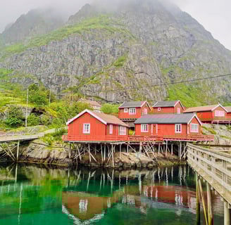 Historic Å fishing village with red cabins and docks near Maritime Munchies in Lofoten Islands