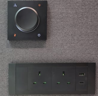 Power outlet panel with dial switch on felt wall
