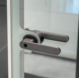 Glass door handle with clean black finish
