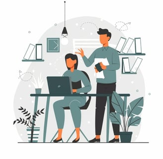 a man and woman sitting at a desk with a laptop