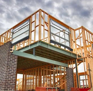 a house being built with a large wooden frame