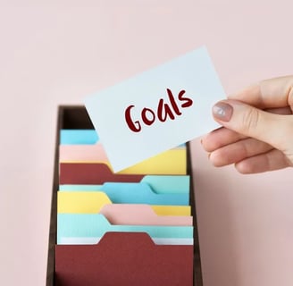 a person holding a note card with a notepad on it