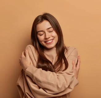 a woman with her arms crossed and smiling
