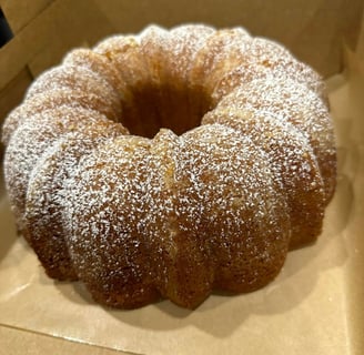 a cake with a bunt of powdered sugar on top of it