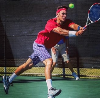 Photo of The Health Unit Founder Dan Manlow playing college tennis