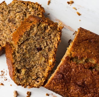 Slices of brown butter banana bread with walnuts
