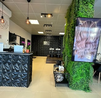 a salon and spa with a green wall