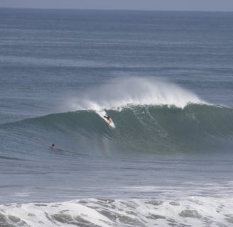 perfect wave been ridden by a bodyboarder
