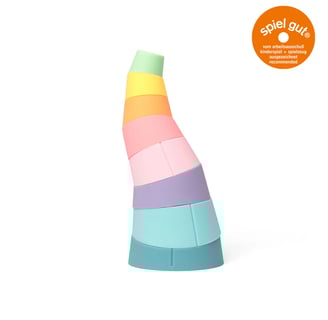 A curved tower made of colorful stacking rings