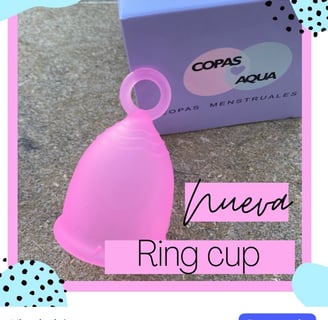 a pink cupcake with a pink cupcake on top of it