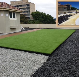 Artificial grass rooftop deck with pebble surrounds