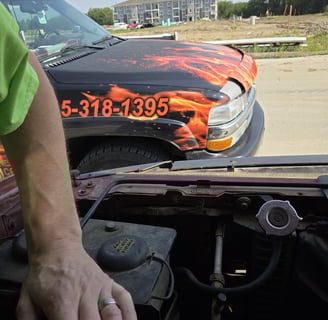 Fast T's Spark Plug Replacement Service on location in Waukee Iowa performing a spark plug replacement on a truck