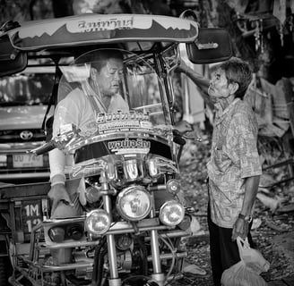 Negotiating a tuk-tuk ride in Thailand, spotted by Peter Pickering