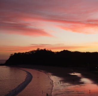 samara, costa rica beach with a sunset in the background