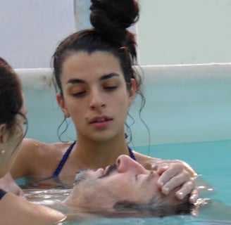 a man and woman in a swimming pool, rebirth and Repair, watsu
