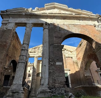Ancient columns in ruins at the Temple of Saturn in Rome, Italy