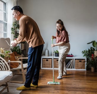 Couple deep cleaning their home before a sale