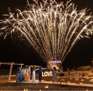 Dazzling Santorini fireworks illuminating a romantic wedding night sky.