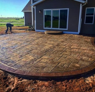 a patio with a brick patio with a brick patio