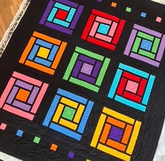 Colorful cabin windows quilt