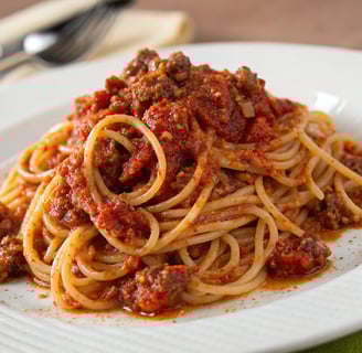 a plate of pasta with spaghetti sauce