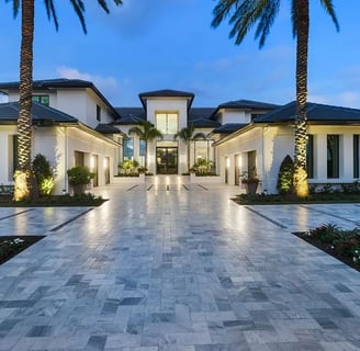 a large house with a driveway leading to a large driveway