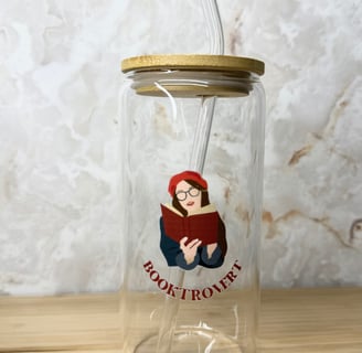 a glass jar with a straw and a straw in it for book lovers and readers 