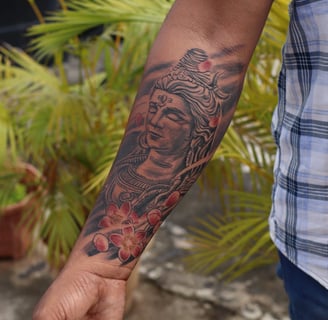 Black and grey Shiva tattoo in meditative pose by Dudo’s Tattoos in Hyderabad
