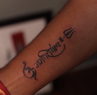 Om Namah Shivay Tattoo by Dudos Tattoos and Piercing Hyderabad