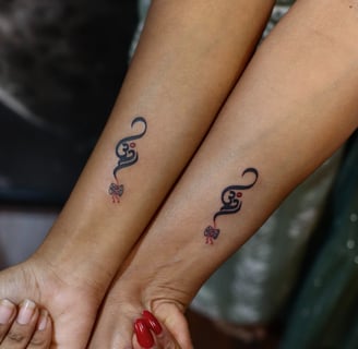 Sacred Om symbol tattoo in fine line style by Dudo’s Tattoo Studio Hyderabad