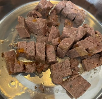 Close up of Edgard & Cooper Game & Duck wet food showing texture