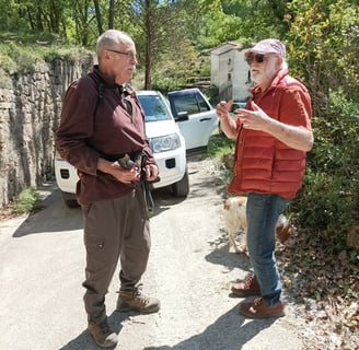 B. chatting to our neighbour Roland.