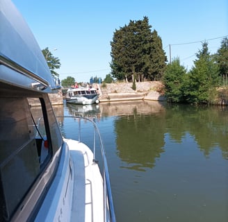 A hire boat leaves the Round Lock before we can enter