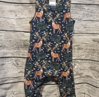 a baby's romper with a deer print