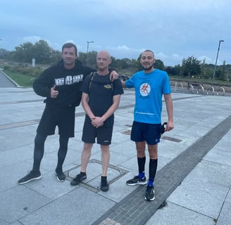 three runners posing for a photo