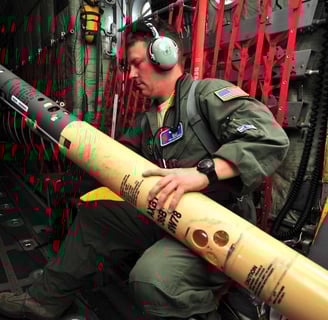 Loadmaster Tech. Sgt. Christopher Becvar (USAF) readies AXBT for Dorian remnants 29July2013. Photo: Tech. Sgt. Ryan Labadens.