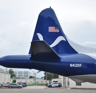 "N42RF" tail section with Tail radar housing sticking out back of aircraft. Photo: AOML/ NOAA. 