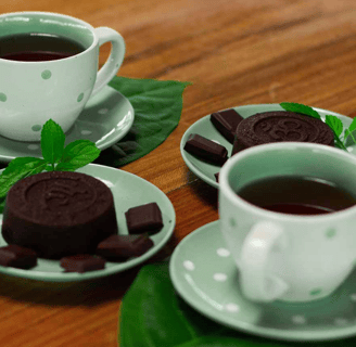 a cup of tea and cookies on a table